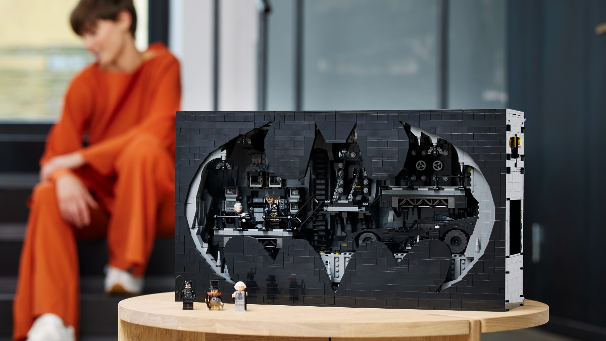 lego batman 76252 batcave shadow box lifestyle background person featured